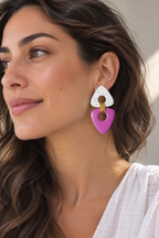 Model wearing handcrafted pink polymer clay statement earrings with gold wire details by Aygem Art Studio.