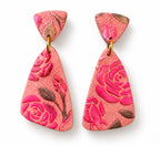 Rosa Coral handmade polymer clay earrings with pink rose design on a coral base, shown on a white background