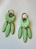 Willow Mint handmade polymer clay earrings with mint green leaf-shaped drops on 18k gold-plated hoops, laid flat on white